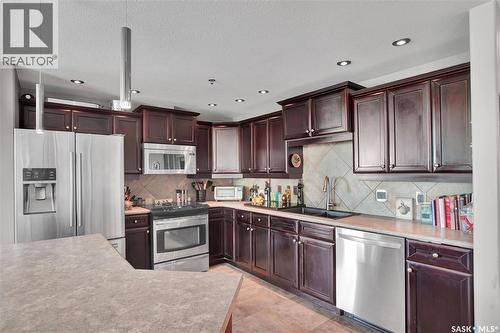 219 619 Saskatchewan Crescent W, Saskatoon, SK - Indoor Photo Showing Kitchen With Double Sink