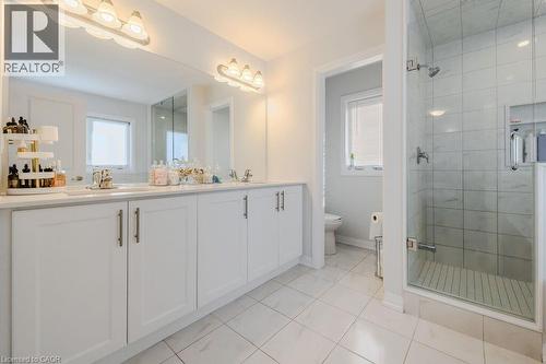 Bathroom with tile patterned flooring, vanity, toilet, and plenty of natural light - 53 Mackay Drive, Woodstock, ON - Indoor Photo Showing Bathroom
