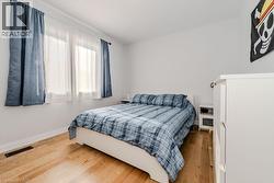 Bedroom featuring wood-type flooring - 