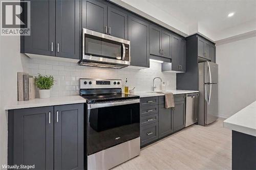 Virtually Staged - 525 Erinbrook Drive Unit# C052, Kitchener, ON - Indoor Photo Showing Kitchen With Stainless Steel Kitchen With Upgraded Kitchen