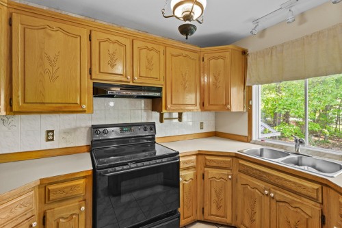 Kitchen - 1780 Rue Cedar, Mascouche, QC - Indoor Photo Showing Kitchen With Double Sink