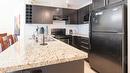 218-1089 Sunset Drive, Kelowna, BC  - Indoor Photo Showing Kitchen With Double Sink With Upgraded Kitchen 