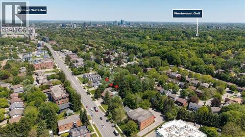 Aerial perspective showcasing a residential area with extensive tree coverage - 395 Erb Street, Waterloo, ON 