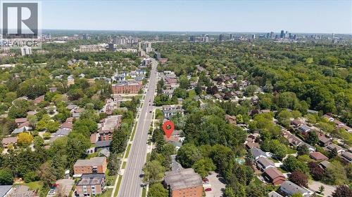 Aerial perspective showcasing a residential neighborhood with extensive tree canopies - 395 Erb Street, Waterloo, ON 