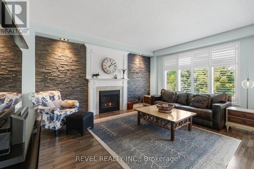 74 Mount Crescent, Essa, ON - Indoor Photo Showing Living Room With Fireplace