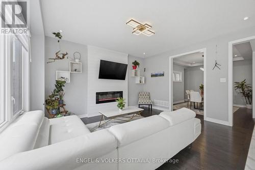 139 Switch Grass Crescent, Ottawa, ON - Indoor Photo Showing Living Room With Fireplace