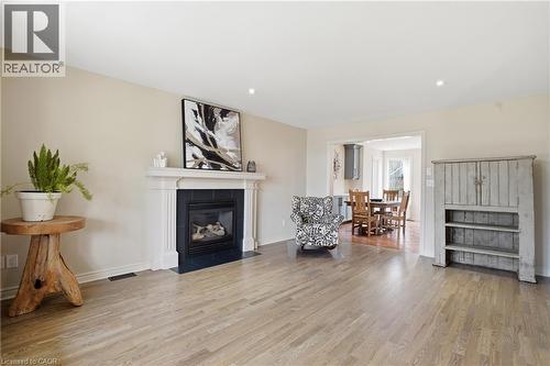 Sitting room featuring light wood-style flooring, a fireplace, and recessed lighting - 56 Mccaffery Crescent, St. Catharines, ON - Indoor Photo Showing Living Room With Fireplace