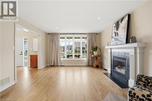 Living room with light wood-style flooring, a fireplace, and recessed lighting - 56 Mccaffery Crescent, St. Catharines, ON - Indoor Photo Showing Living Room With Fireplace