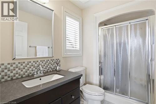 Full bath with a shower stall, vanity, and backsplash - 56 Mccaffery Crescent, St. Catharines, ON - Indoor Photo Showing Bathroom