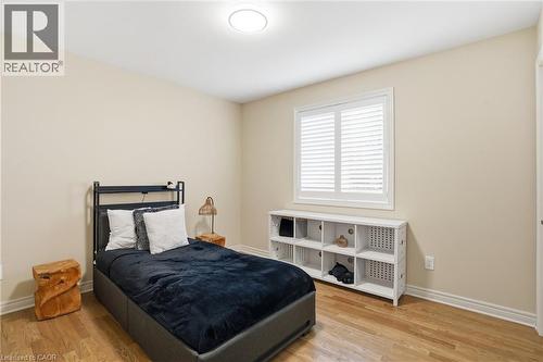 Bedroom with light wood-style flooring and baseboards - 56 Mccaffery Crescent, St. Catharines, ON - Indoor Photo Showing Bedroom