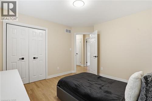 Bedroom with light wood-style flooring and a closet - 56 Mccaffery Crescent, St. Catharines, ON - Indoor Photo Showing Bedroom