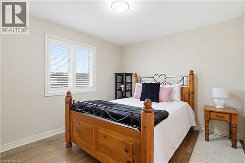 Bedroom featuring wood finished floors and baseboards - 56 Mccaffery Crescent, St. Catharines, ON - Indoor Photo Showing Bedroom