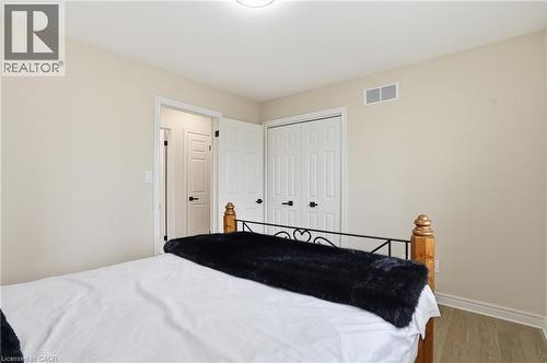 Bedroom with wood finished floors and a closet - 56 Mccaffery Crescent, St. Catharines, ON - Indoor Photo Showing Bedroom