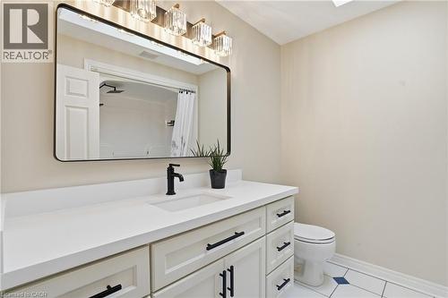 Full bath featuring vanity and a shower with shower curtain - 56 Mccaffery Crescent, St. Catharines, ON - Indoor Photo Showing Bathroom