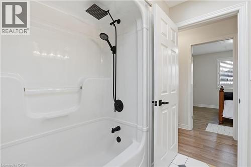 Bathroom with light wood finished floors, shower / washtub combination, and ensuite bath - 56 Mccaffery Crescent, St. Catharines, ON - Indoor Photo Showing Bathroom
