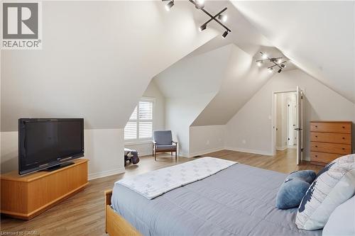 Bedroom with track lighting, light wood finished floors, and lofted ceiling - 56 Mccaffery Crescent, St. Catharines, ON - Indoor Photo Showing Bedroom