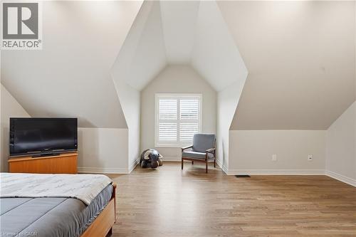 Bedroom with light wood-style flooring and lofted ceiling - 56 Mccaffery Crescent, St. Catharines, ON - Indoor