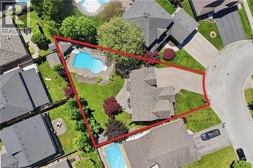Curved driveway leading to a multi-level roofline residence - 56 Mccaffery Crescent, St. Catharines, ON - Outdoor With In Ground Pool With View
