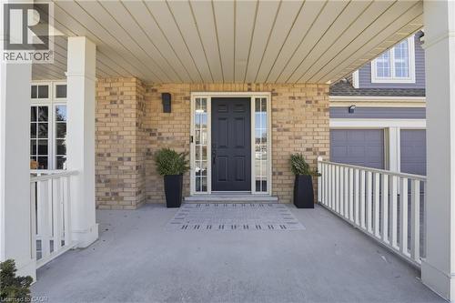 Property entrance featuring covered porch and brick siding - 56 Mccaffery Crescent, St. Catharines, ON - Outdoor With Exterior