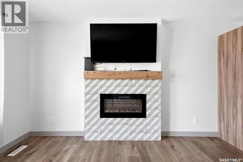 306 Howe Place, Regina, SK - Indoor Photo Showing Living Room With Fireplace