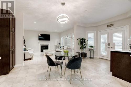 85 Showcase Drive, Hamilton, ON - Indoor Photo Showing Dining Room With Fireplace