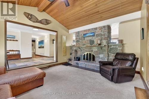 Sunken Living Room w/2 sided stone fireplace - 10655 Sideroad 17, Brock, ON 