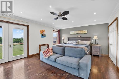 Primary Bedroom w/Juliet balcony & double closet. - 10655 Sideroad 17, Brock, ON 