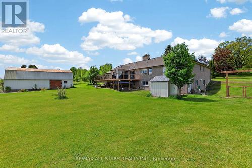 Rear deck, Barn, side entrance to in-law suite. - 10655 Sideroad 17, Brock, ON 