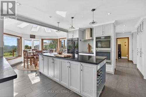 Main level Kitchen. Walkout to huge deck - 10655 Sideroad 17, Brock, ON 