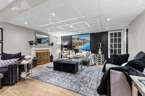 Family Room - 496 Rue Fortin, Napierville, QC - Indoor With Fireplace