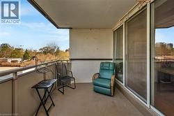 Outdoor balcony with a smooth concrete floor and a metal railing - 