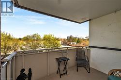 Outdoor balcony space featuring a concrete floor and a metal railing - 