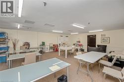 Spacious room featuring neutral carpeting and cream-colored walls - 