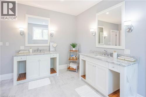 Dual white vanity sinks with marble countertops and chrome fixtures - 1521 Emily Lane, Severn, ON - Indoor Photo Showing Bathroom