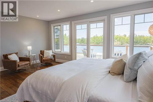 Room with wood-finish flooring and light gray walls - 1521 Emily Lane, Severn, ON - Indoor Photo Showing Bedroom