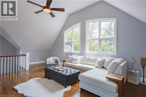 Attic space featuring wood-finish flooring, vaulted ceilings, and a ceiling fan - 1521 Emily Lane, Severn, ON - Indoor Photo Showing Living Room