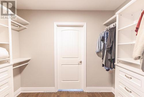Walk thru closet from primary bedroom to bathroom - 3314 Montreal Road, Cornwall, ON - Indoor With Storage