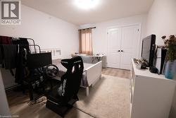 Neutral white walls complement the wood-finish flooring - 