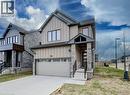 Contemporary two-story residence featuring a stone and vertical siding exterior - 32 Faith Street Unit# 19, Cambridge, ON  - Outdoor 