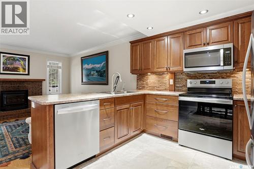 2231 Mcintyre Street, Regina, SK - Indoor Photo Showing Kitchen With Fireplace With Double Sink With Upgraded Kitchen