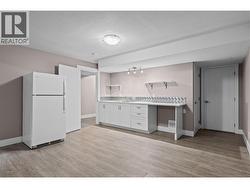Kitchen, Dining Space with Fridge, Built-Ins and Double Sink - 