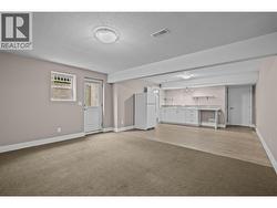 Open Concept Living Space with Private Egress, Under Stairs Storage and access to Utility Room - 