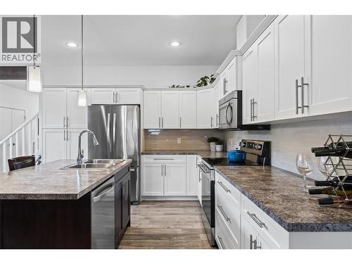 Stainless Steel Appliances - 827 Juniper Road, Kelowna, BC - Indoor Photo Showing Kitchen With Double Sink With Upgraded Kitchen
