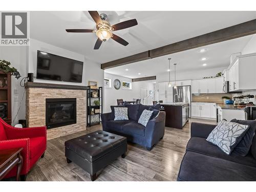 Open Concept - Great for Family and Entertaining - 827 Juniper Road, Kelowna, BC - Indoor Photo Showing Living Room With Fireplace