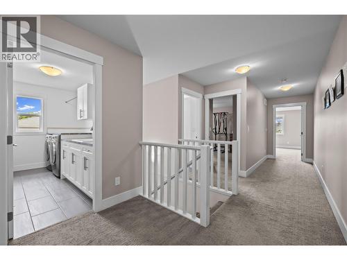 Spacious Halls to Upper Level Rooms - 827 Juniper Road, Kelowna, BC - Indoor Photo Showing Other Room