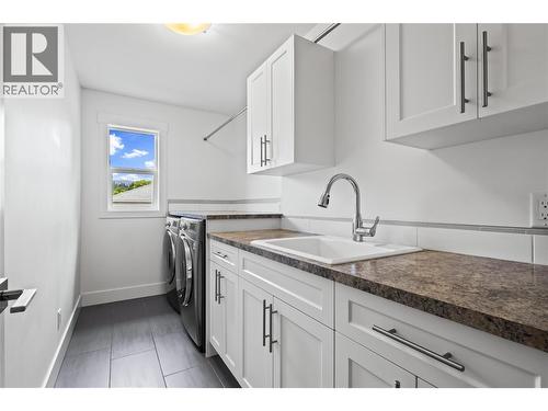 Lovely Laundry Room with Built-Ins and Wash Sink - 827 Juniper Road, Kelowna, BC - Indoor