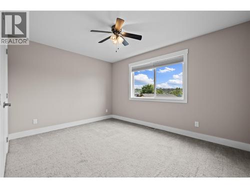 Large front Bedroom with Large Closet - 827 Juniper Road, Kelowna, BC - Indoor Photo Showing Other Room