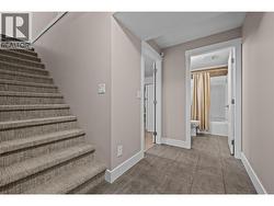 Finished Basement Landing to Full Bathroom and Open Concept Living Space - 