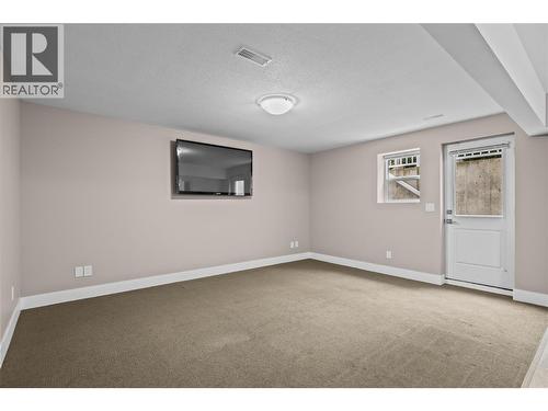 Great Room Entertaining Space with Private Entrance - 827 Juniper Road, Kelowna, BC - Indoor Photo Showing Other Room