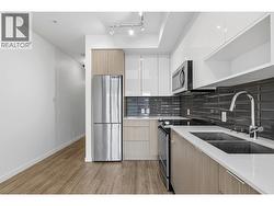 Gourmet Kitchen with stainless steel appliances and quartz countertops - 